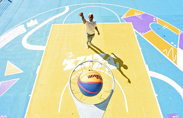 Kofi Josephs standing on the repainted Summerfield Park court, seen from above through the hoop