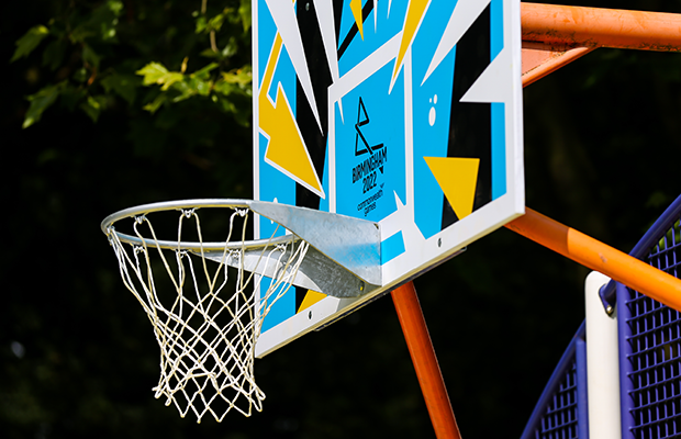Close-up of the court's hoop and hand-painted Birmingham 2022 backboard